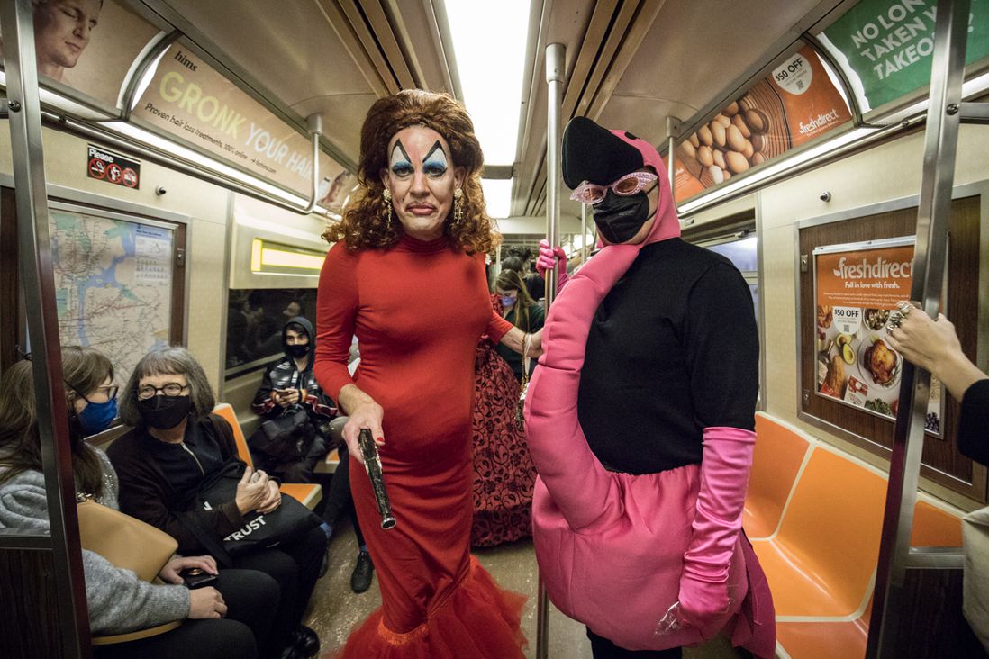 Photos of people dressed up in costumes on the subway for Halloween 2021